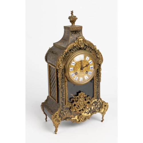 135 - A FRENCH BOULLE MATEL CLOCK. Movement by Japy Freres, sunburst pendulum, embossed gilt dial with ena... 