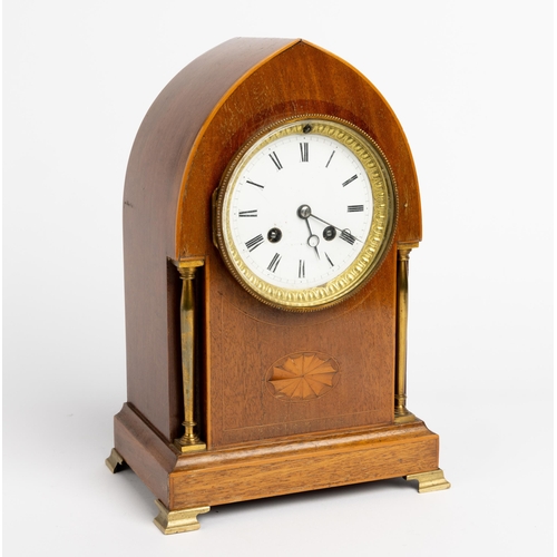 141 - A FRENCH MAHOGANY MANTEL CLOCK. Stamped Vincenti in a lancet case flanked by free standing brass col... 