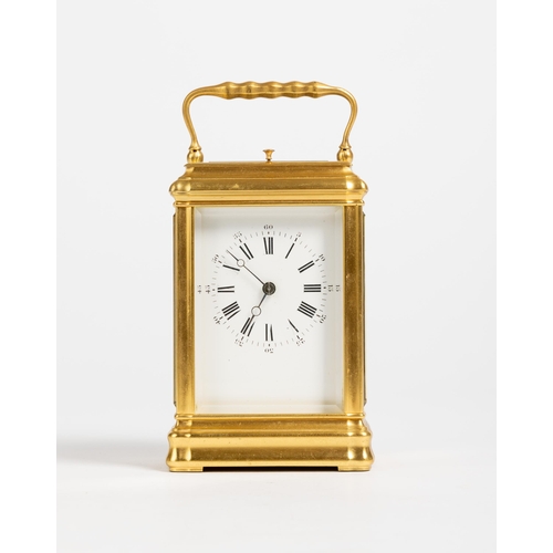 167 - A CARRIAGE CLOCK IN GORGE CASE White enamel dial, repeating movement with lever platform.13cm