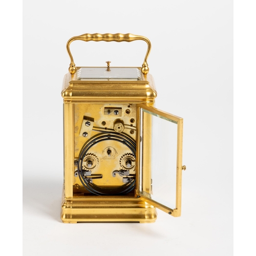 167 - A CARRIAGE CLOCK IN GORGE CASE White enamel dial, repeating movement with lever platform.13cm