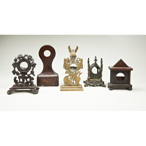 193 - FIVE WATCHSTANDS; one in gothic architectural case; one case iron with grapes; one in waisted inlaid... 