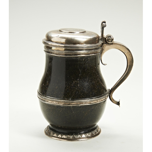 376 - A SILVER MOUNTED HARD STONE TANKARD The lid engraved with an armorial and order of St George Garter.... 