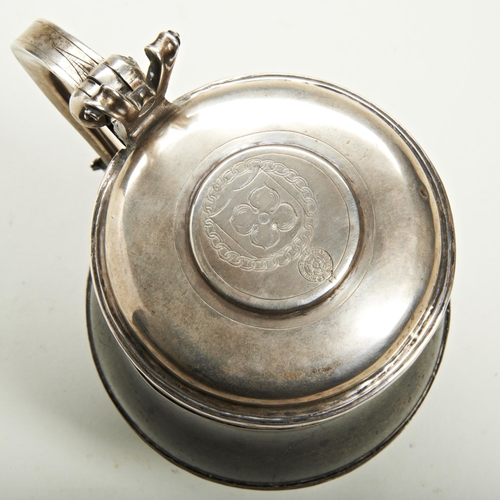 376 - A SILVER MOUNTED HARD STONE TANKARD The lid engraved with an armorial and order of St George Garter.... 