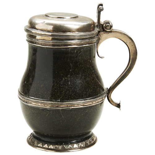 376 - A SILVER MOUNTED HARD STONE TANKARD The lid engraved with an armorial and order of St George Garter.... 