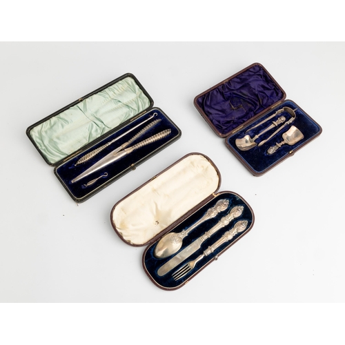 393 - A CASED CHRISTENING SET, SHEFFIELD 1869 Together with a cased pair of button hooks and a glove stret... 