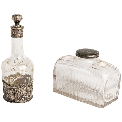 343 - A SILVER MOUNTED DECANTER, C.1880 Together with another oblong travel decanter21 cm.