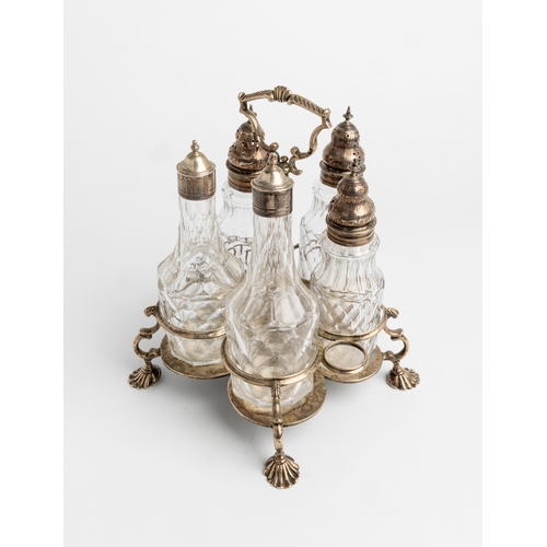 409 - A GEORGE III CRUET FRAME LONDON 1762 A silver cruet frame with five bottles.