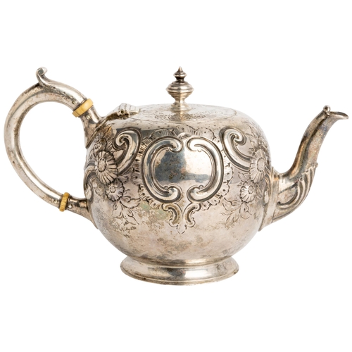 417 - A SMALL SPHERICAL VICTORIAN TEAPOT, LONDON 1872 Embossed with flowers and scrolls, with a silver han... 