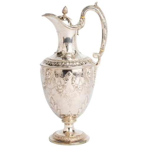 420 - AN URN SHAPED VICTORIAN CLARET JUG, LONDON 1873 With engraved and embossed decoration between cast a... 