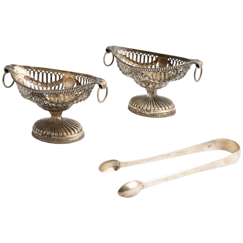 422 - A PAIR OF PIERCED NAVETTE SHAPED VICTORIAN SALTS, LONDON 1865 With embossed swags and ring handles. ... 