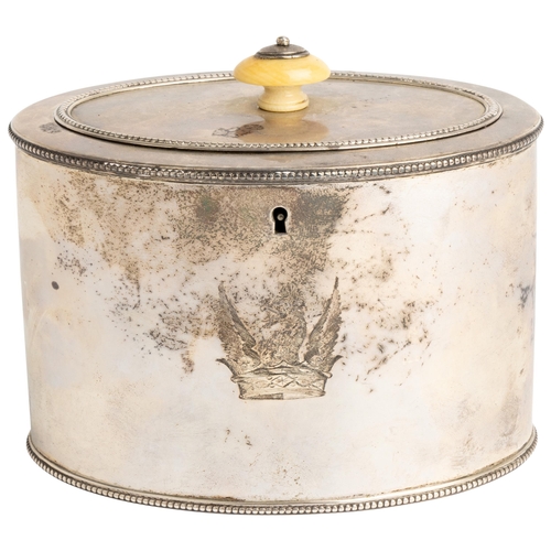 441 - A GEORGE III OVAL TEA CADDY, LONDON 1784 With a flat hinged lid and bead rims. Engraved to the body ... 