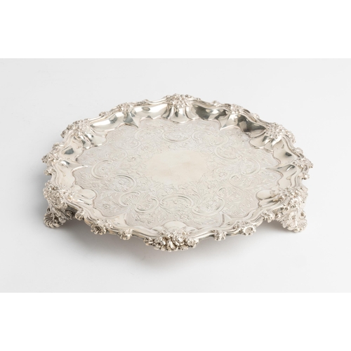 442 - A GEORGE IV FLAT CHASED SALVER, LONDON 1833 With a scroll and cast florate rim. 25 cm.521 g.... 