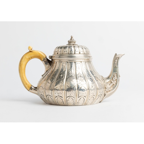 450 - A COMPRESSED BALUSTER SHAPE TEAPOT, LONDON 1843 With flat chased early 18th century style decoration... 