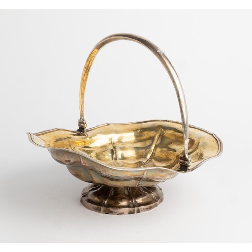 351 - A RUSSIAN SWING HANDLE BASKET, MOSCOW 1869 The interior of the basket is gilded, the body engraved w... 