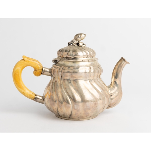 354 - AN AUSTRO-HUNGARIAN TEAPOT C. 1840 With a spirally fluted body and cast acorn finial.22 cm.492 g.... 