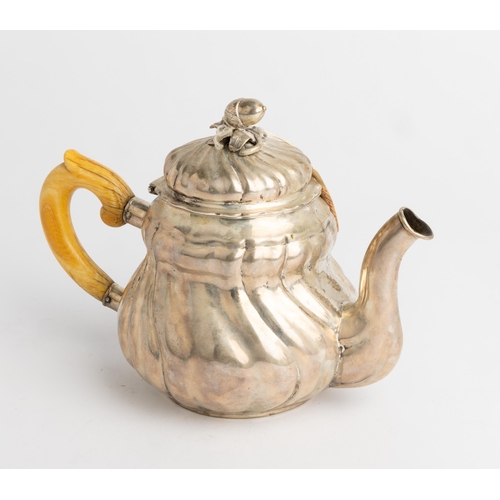 354 - AN AUSTRO-HUNGARIAN TEAPOT C. 1840 With a spirally fluted body and cast acorn finial.22 cm.492 g.... 