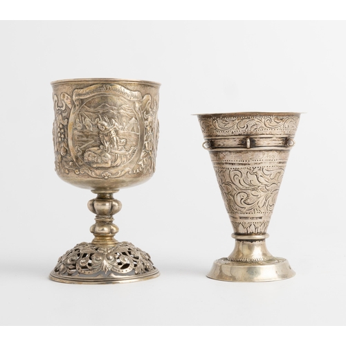 355 - A GERMAN EMBOSSED GOBLET AND A SCANDINAVIAN BEAKER, C.1870 The German goblet with pierced base, mark... 