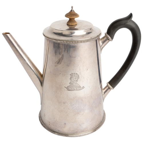 462 - A PLAIN TAPERING COFFEE POT, LONDON 1885 With bead rims, engraved to the body with a crest.18 cm.422... 