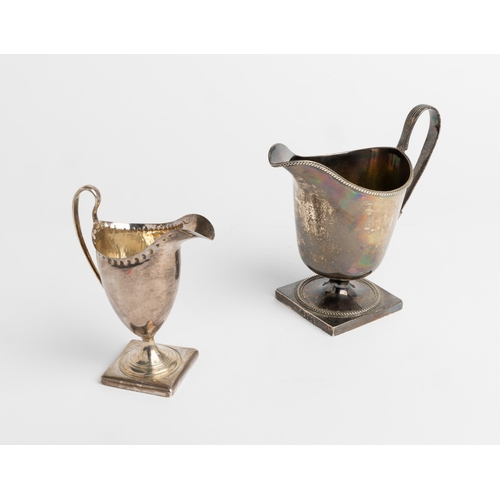 482 - A LARGE GEORGE III HELMET SHAPE CREAM JUG, LONDON 1801 Together with another helmet shape jug, Londo... 