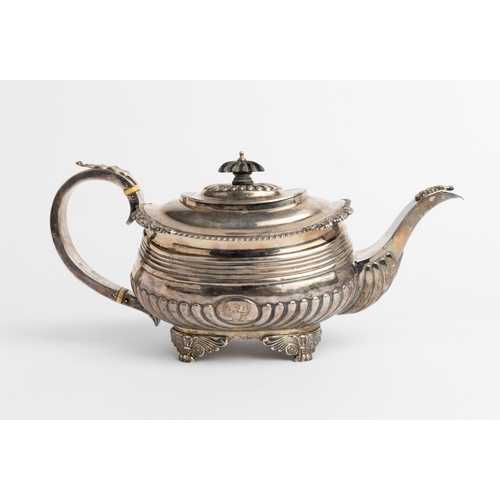 483 - A LARGE GEORGE III HALF FLUTED TEAPOT, LONDON 1817 With a silver handle and cast decoration.33 cm.73... 