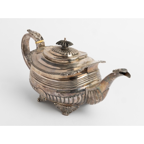 483 - A LARGE GEORGE III HALF FLUTED TEAPOT, LONDON 1817 With a silver handle and cast decoration.33 cm.73... 