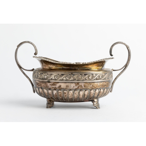 587 - A HALF FLUTED GEORGE IV OBLONG SUGAR BOWL, DUBLIN 1822 With cast rim and chased floral band.21 cm.29... 