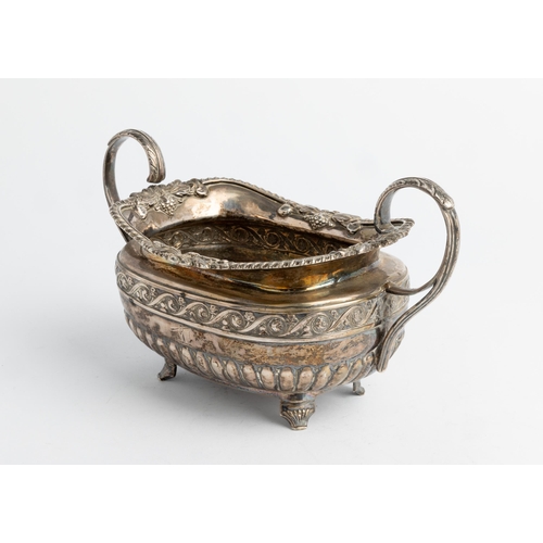 587 - A HALF FLUTED GEORGE IV OBLONG SUGAR BOWL, DUBLIN 1822 With cast rim and chased floral band.21 cm.29... 