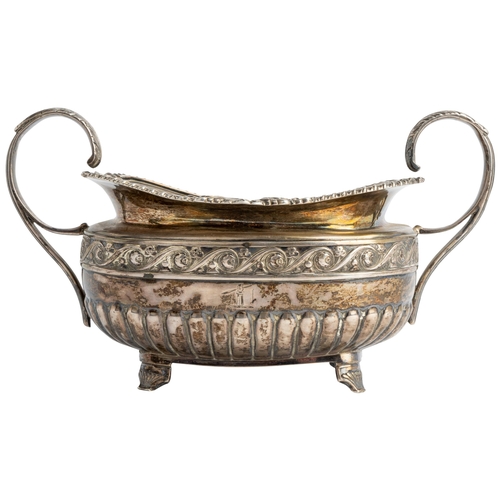 587 - A HALF FLUTED GEORGE IV OBLONG SUGAR BOWL, DUBLIN 1822 With cast rim and chased floral band.21 cm.29... 