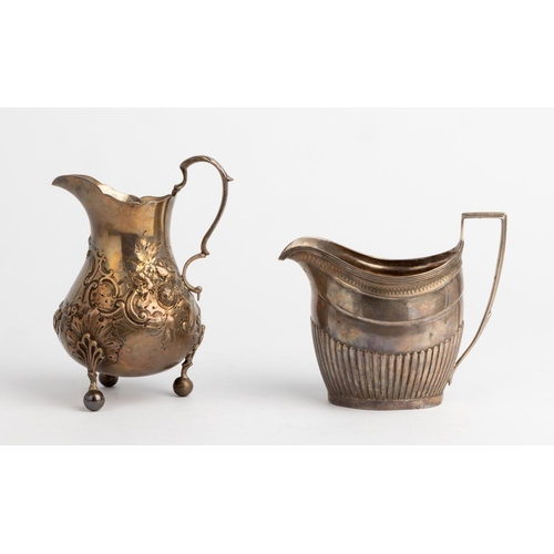 486 - A LARGE GEORGE III HALF FLUTED CREAM JUG, LONDON 1803 Together with a large baluster shape embossed ... 