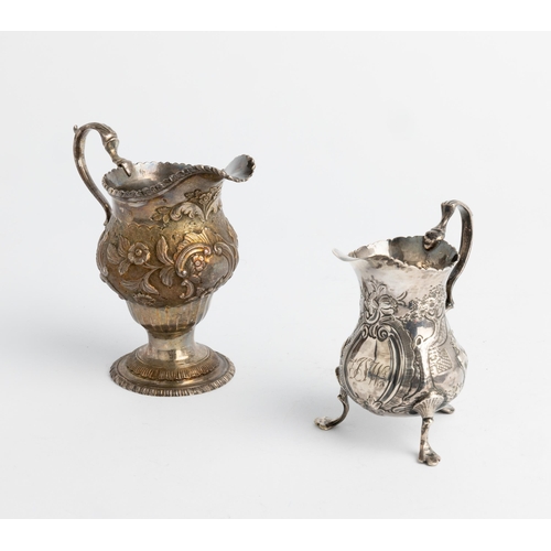 487 - A LARGE GEORGE III CHASED AND FLUTED CREAM JUG, LONDON 1770 Together with another small chased cream... 