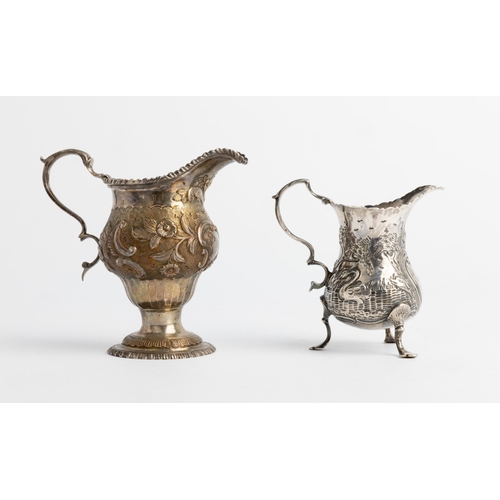 487 - A LARGE GEORGE III CHASED AND FLUTED CREAM JUG, LONDON 1770 Together with another small chased cream... 