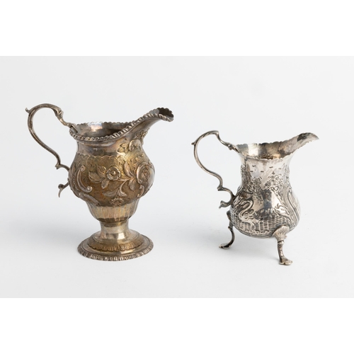 487 - A LARGE GEORGE III CHASED AND FLUTED CREAM JUG, LONDON 1770 Together with another small chased cream... 