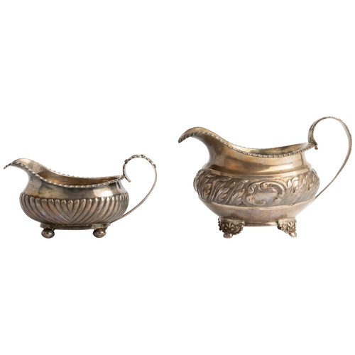 488 - A GEORGE IV OBLONG CREAM JUG WITH CHASED ACANTHUS BAND, LONDON 1823 Together with another half flute... 