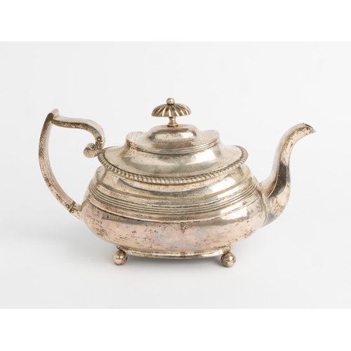 500 - A LARGE GEORGE IV OBLONG REEDED TEAPOT, EXETER 1821 With gadroon edge on 4 ball feet. 28 cm.560 g.... 