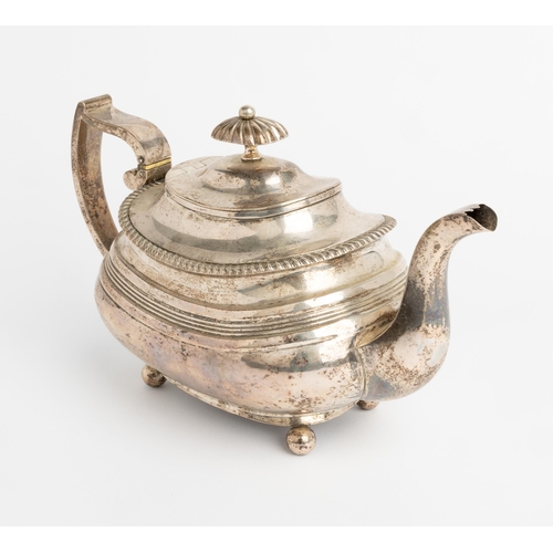 500 - A LARGE GEORGE IV OBLONG REEDED TEAPOT, EXETER 1821 With gadroon edge on 4 ball feet. 28 cm.560 g.... 