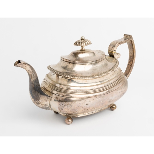 500 - A LARGE GEORGE IV OBLONG REEDED TEAPOT, EXETER 1821 With gadroon edge on 4 ball feet. 28 cm.560 g.... 