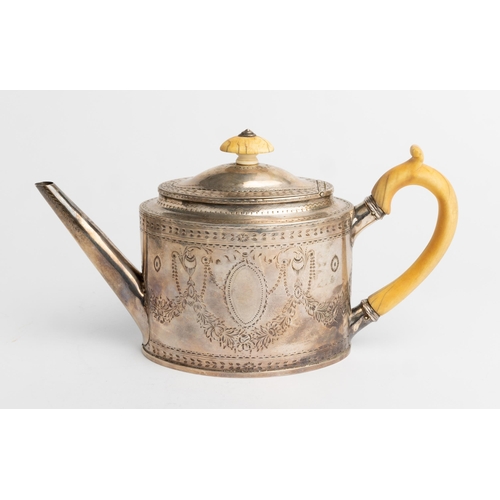 515 - A GEORGE III OVAL TEAPOT WITH ENGRAVED DECORATION, LONDON 178527 cm.476 g.