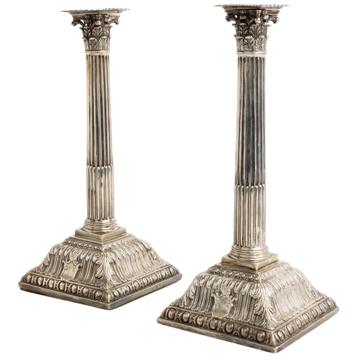 518 - A VERY LARGE PAIR OF CORINTHIAN COLUMN CANDLESTICKS, LONDON 1763 Each engraved with full armorial, w... 