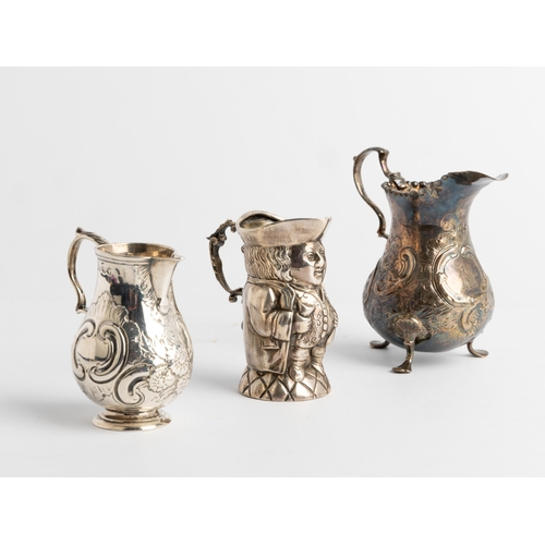 543 - A SILVER TOBY JUG, IMPORT MARKED LONDON 1902 Together with two baluster shape cream jugs, London 175... 