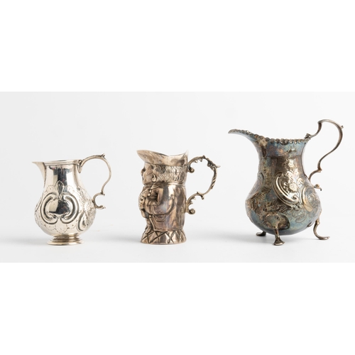 543 - A SILVER TOBY JUG, IMPORT MARKED LONDON 1902 Together with two baluster shape cream jugs, London 175... 