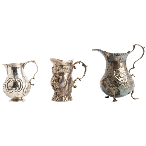 543 - A SILVER TOBY JUG, IMPORT MARKED LONDON 1902 Together with two baluster shape cream jugs, London 175... 