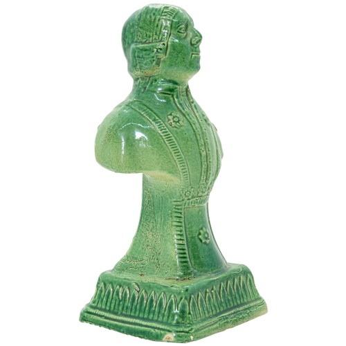 849 - A GREEN GLAZED POTTERY BUSTLATE 18TH CENTURYDepicting a bewigged gentleman, raised on a socle, 18.5c... 
