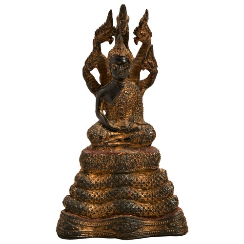 2231 - A GILT BRONZE FIGURE OF BUDDHA UNDER MUCHALINDATHAILAND, MIDE 19TH CENTURY14cm high