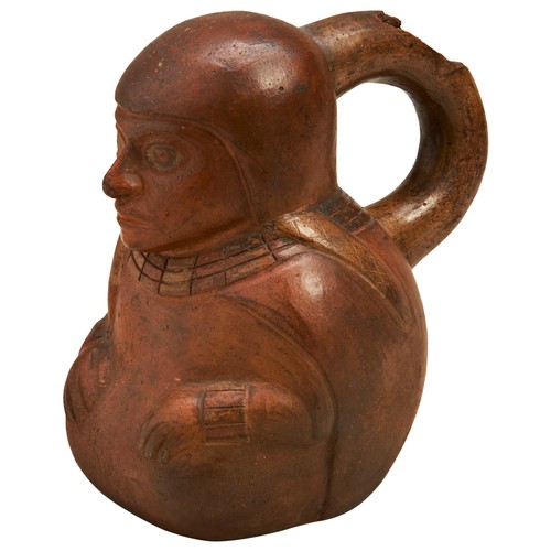 1200 - A MOCHE POTTERY STIRRUP-SPOUT VESSEL IN THE FORM OF A SEATED FIGURE. 14cms high