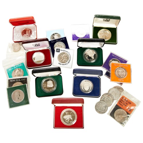 316 - A NEW ZEALAND 1979 ONE DOLLAR SILVER PROOF COIN, six others all cased and various other New Zealand ... 