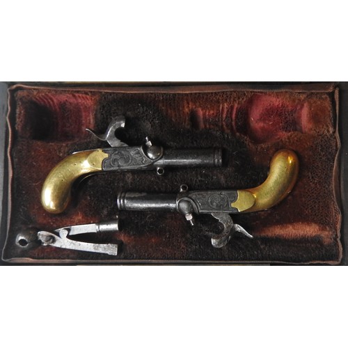 631 - A CASED 19TH CENTURY PAIR OF MINIATURE PERCUSSION PISTOLS with engraved decoration, drop down trigge... 