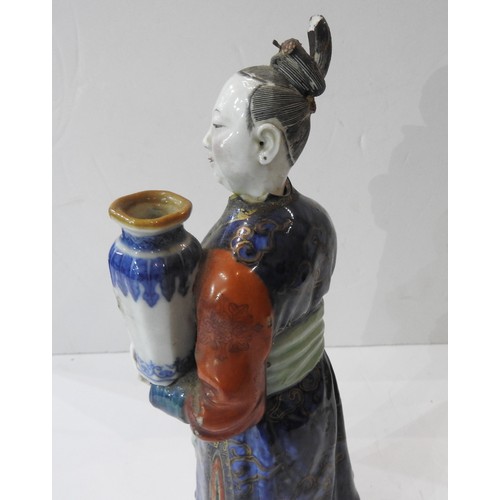 1996 - A CHINESE NODDING-HEAD FIGURE OF A COURT LADY CANDLE HOLDERQIANLONG PERIOD (1736-1795)the standing f... 