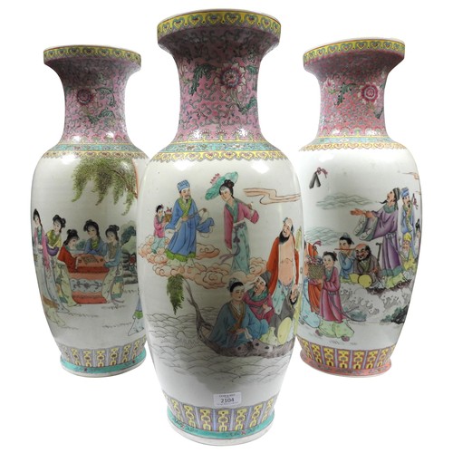 2104 - THREE CHINESE FAMILLE ROSE BALUSTER VASES20TH CENTURYeach with bearing a calligraphic inscription61c... 