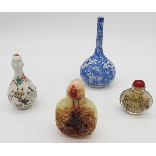 293 - THREE CHINESE SNUFF BOTTLES AND A BOTTLE VASE, the lot includes a garlic mouth snuff bottle, a rever... 