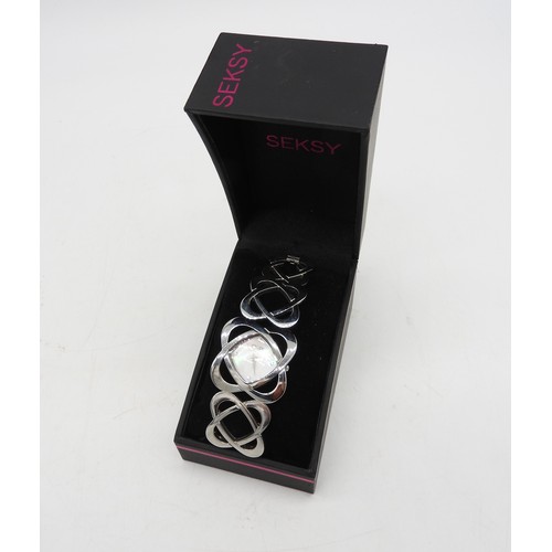 575 - MODERN SEKSY WATCHLadies boxed Seksy bracelet watch with mother of pearl dial. The bracelet with gra... 